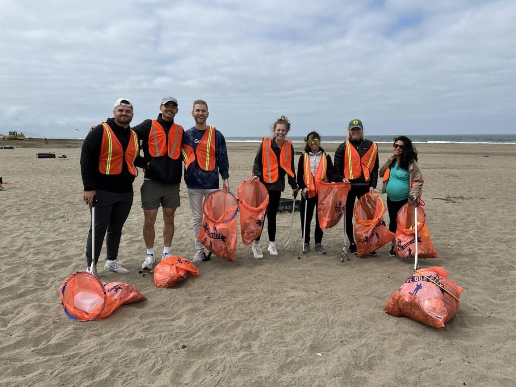 Volunteers removing plastic pollution from a beach during an environmental conservation campaign in the USA.